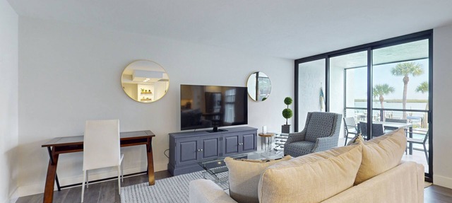 Luxury waterfront condo with shared pool, hot tub, and a tennis court