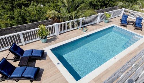 Stay in a Long Bay Beach Villa with a Shared Pool